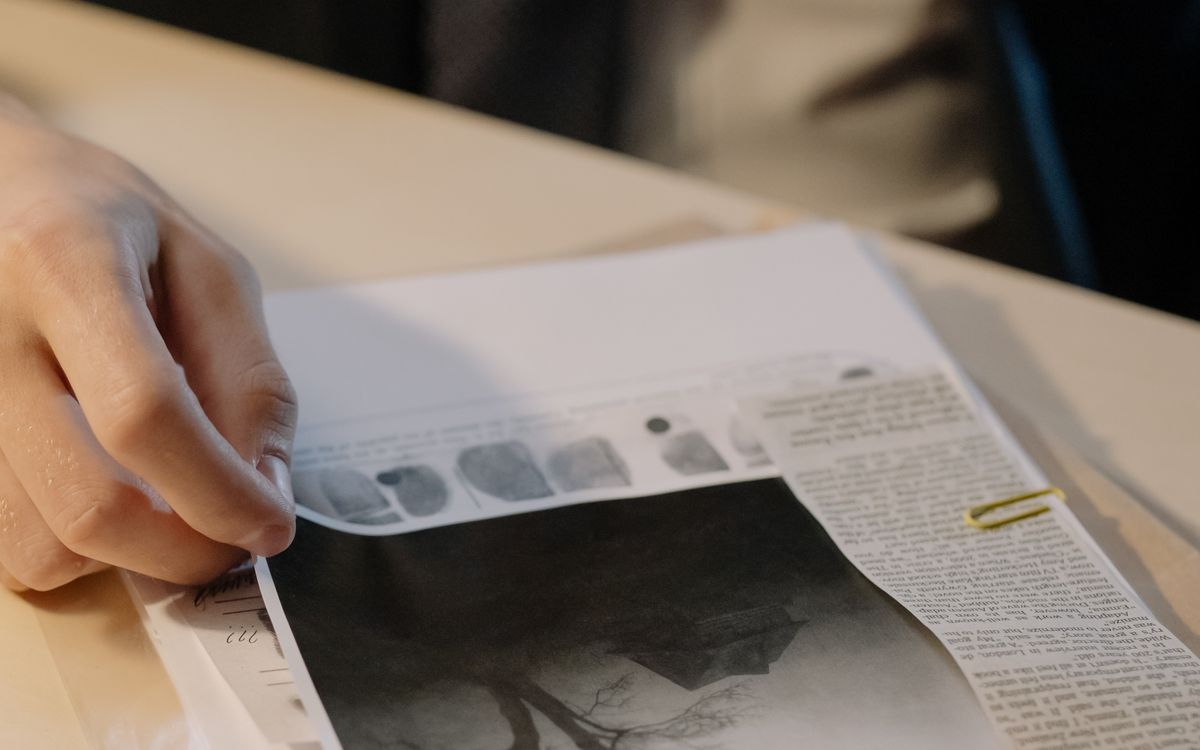 A person reviewing printed business documents
