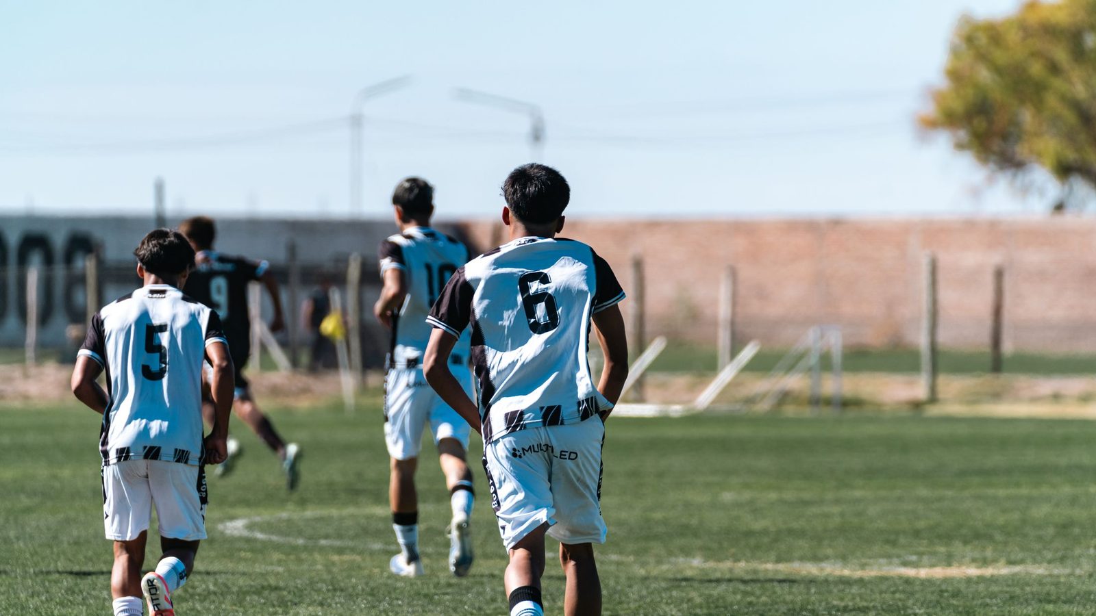 Football players walking together after a match