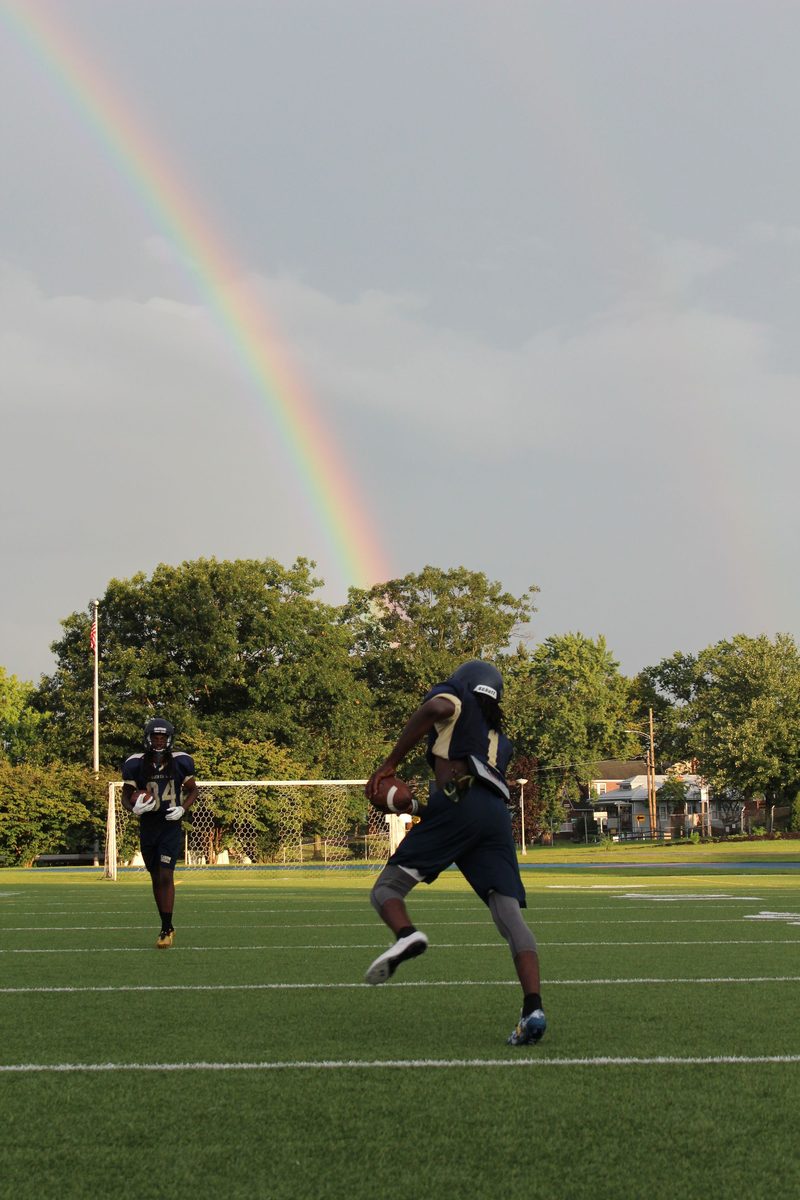 American football players training on an outdoor field