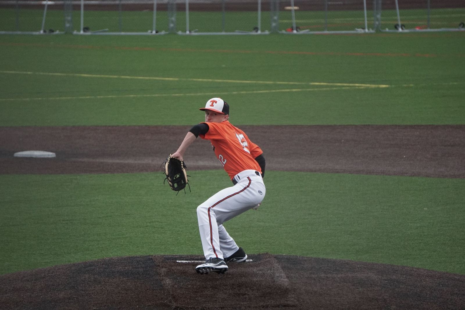 Baseball player pitching during a game